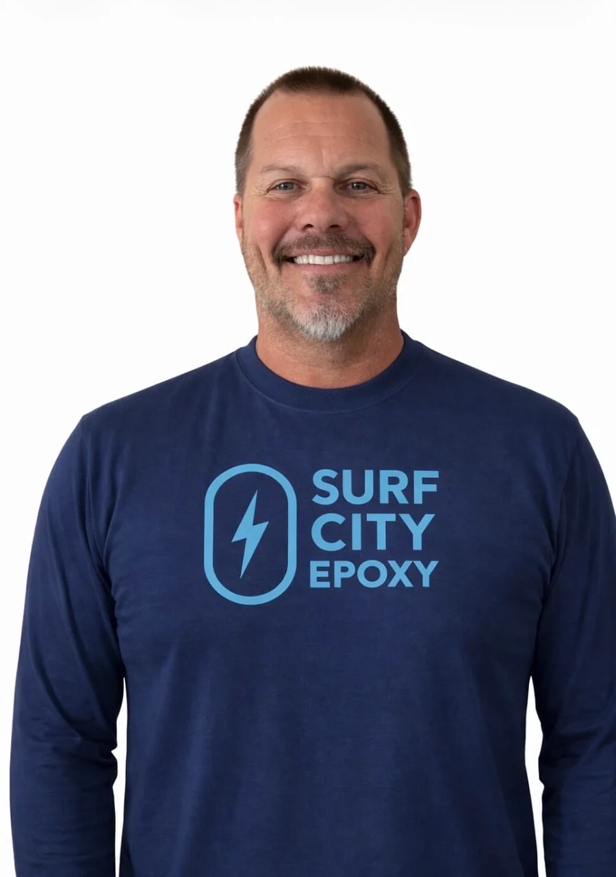 Sean Jensen, founder of Surf City Epoxy, wearing a Surf City Epoxy shirt